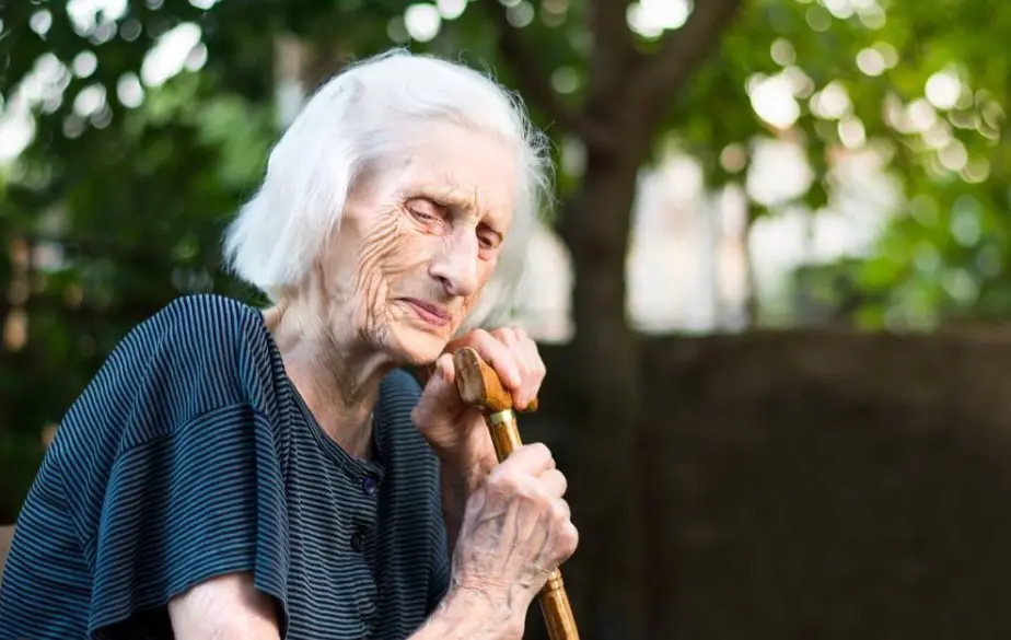 older woman with cane